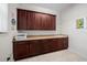 Spacious laundry room with cabinets and sink at 5106 Nw 35Th Lane Rd, Ocala, FL 34482