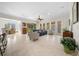 Open concept living room with access to the screened lanai and dining area at 5106 Nw 35Th Lane Rd, Ocala, FL 34482
