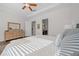 Main bedroom with a dresser and bathroom access at 5106 Nw 35Th Lane Rd, Ocala, FL 34482