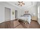 Bright main bedroom with a ceiling fan and en-suite bathroom at 5106 Nw 35Th Lane Rd, Ocala, FL 34482