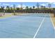 Well-maintained tennis court with new nets at 5106 Nw 35Th Lane Rd, Ocala, FL 34482