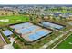 Tennis courts with people playing at 5106 Nw 35Th Lane Rd, Ocala, FL 34482