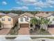 Three-story houses in a row with brick driveways and pools at 5437 Misty Oak Cir, Davenport, FL 33837