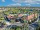Community pool and clubhouse with palm trees at 5437 Misty Oak Cir, Davenport, FL 33837