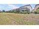 Large backyard with home and enclosure at 5437 Misty Oak Cir, Davenport, FL 33837
