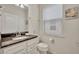 Clean bathroom with granite countertop and white vanity at 5437 Misty Oak Cir, Davenport, FL 33837