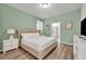 Large bedroom with a king-size bed and en-suite bathroom at 5437 Misty Oak Cir, Davenport, FL 33837