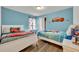 bedroom with two twin beds and Cars and Mario themed decor at 5437 Misty Oak Cir, Davenport, FL 33837