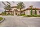 Community clubhouse entrance with arch and landscaping at 5437 Misty Oak Cir, Davenport, FL 33837