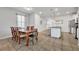 Formal dining room with a wood table and kitchen views at 5437 Misty Oak Cir, Davenport, FL 33837