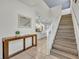 Bright entryway with staircase, console table and kitchen view at 5437 Misty Oak Cir, Davenport, FL 33837