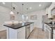 Island kitchen with granite countertops and white cabinetry at 5437 Misty Oak Cir, Davenport, FL 33837