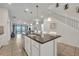 Modern kitchen with island, stainless steel appliances at 5437 Misty Oak Cir, Davenport, FL 33837