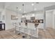 Eat-in kitchen with breakfast bar and white cabinets at 5437 Misty Oak Cir, Davenport, FL 33837