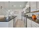 Spacious kitchen featuring an island and white cabinets at 5437 Misty Oak Cir, Davenport, FL 33837