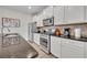 Modern kitchen with stainless steel appliances and granite countertops at 5437 Misty Oak Cir, Davenport, FL 33837