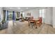 Living and dining room with tile floors and sliding doors at 5437 Misty Oak Cir, Davenport, FL 33837