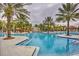 Large community pool with water features at 5437 Misty Oak Cir, Davenport, FL 33837