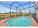 Screened pool and spa with brick patio at 5437 Misty Oak Cir, Davenport, FL 33837