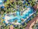 Aerial view of a large resort-style pool with water features at 5437 Misty Oak Cir, Davenport, FL 33837