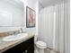 Clean bathroom with granite countertop and shower at 6163 Forest Ridge Way, Winter Haven, FL 33881