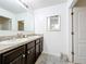 Clean bathroom with double vanity and granite countertops at 6163 Forest Ridge Way, Winter Haven, FL 33881