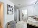 Double vanity bathroom with walk-in closet and shower at 6163 Forest Ridge Way, Winter Haven, FL 33881