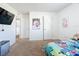 Spacious bedroom with ample natural light and access to other rooms at 6163 Forest Ridge Way, Winter Haven, FL 33881
