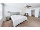 Primary bedroom with king bed and relaxing armchair at 6163 Forest Ridge Way, Winter Haven, FL 33881