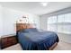 Serene bedroom with a king-size bed and a fun wall design at 6163 Forest Ridge Way, Winter Haven, FL 33881
