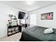 Spacious bedroom with large TV and ample closet space at 6163 Forest Ridge Way, Winter Haven, FL 33881