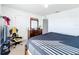 Stylish bedroom with a gamer chair and ample closet space at 6163 Forest Ridge Way, Winter Haven, FL 33881