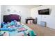 Cozy bedroom with twin bed and L-shaped desk at 6163 Forest Ridge Way, Winter Haven, FL 33881