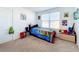 bedroom with twin bed and ample storage at 6163 Forest Ridge Way, Winter Haven, FL 33881