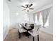 A stylish dining room featuring a modern brick accent wall, elegant curtains, and a sophisticated table setting at 6163 Forest Ridge Way, Winter Haven, FL 33881