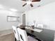 Dining room with dark wood table and white chairs at 6163 Forest Ridge Way, Winter Haven, FL 33881