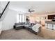 Cozy living room showcasing a large sectional sofa, built-in shelving with a TV, and natural light at 6163 Forest Ridge Way, Winter Haven, FL 33881