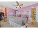 Main bedroom with king-size bed, ceiling fan, and ample closet space at 7403 Glen Oaks Way # 82, Winter Park, FL 32792