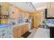Bright kitchen featuring wood cabinets and appliances at 7403 Glen Oaks Way # 82, Winter Park, FL 32792