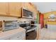 Kitchen features stainless steel appliances and light wood cabinets at 7403 Glen Oaks Way # 82, Winter Park, FL 32792