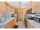 Bright kitchen with light wood cabinets and stainless steel appliances at 7403 Glen Oaks Way # 82, Winter Park, FL 32792