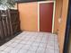 Tiled patio area with access door and fenced perimeter, providing an outdoor space at 7403 Glen Oaks Way # 82, Winter Park, FL 32792