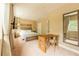 Spacious bedroom with a desk, TV, and large bed at 7535 Brooklyn Dr, Kissimmee, FL 34747