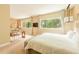Expansive bedroom features a bed, desk, sitting area, and multiple large windows at 7535 Brooklyn Dr, Kissimmee, FL 34747