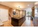 Modern kitchen boasts a spacious island, stainless steel appliances, and an adjacent dining area at 7535 Brooklyn Dr, Kissimmee, FL 34747