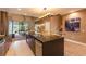 Gourmet kitchen boasting a large island, stainless steel appliances, and an open-concept design at 7535 Brooklyn Dr, Kissimmee, FL 34747
