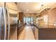 Stylish kitchen with stainless steel appliances, a large island, and seamless flow to the living area at 7535 Brooklyn Dr, Kissimmee, FL 34747