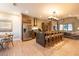 Bright kitchen featuring a center island, modern appliances, and an adjacent dining area at 7535 Brooklyn Dr, Kissimmee, FL 34747
