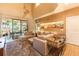 Inviting living room with sliding glass doors, comfortable seating, and stylish decor at 7535 Brooklyn Dr, Kissimmee, FL 34747