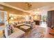 Open concept living room with comfortable seating area flows into a stylish kitchen and dining space at 7535 Brooklyn Dr, Kissimmee, FL 34747